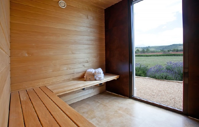 Inspiring-home-design-with-wooden-bench-and-wall-also-ceramic-floor-for-sauna-space